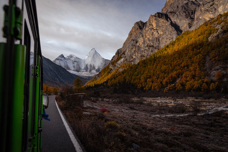 The last Shangri La, view of autumn highland snow mountain of Yading Nature Reserve, snow-capped...