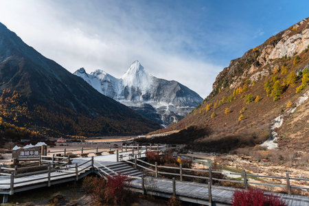 The last Shangri La, view of autumn highland snow mountain of Yading Nature Reserve, snow-capped...