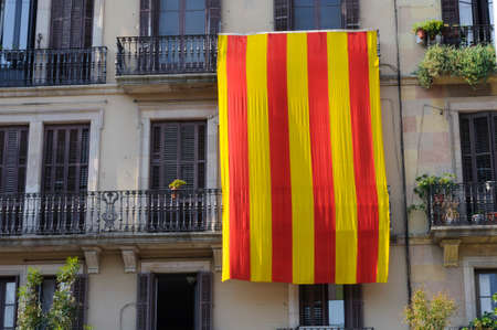 Catalan national flag on a house facade in Barcelona.の写真素材