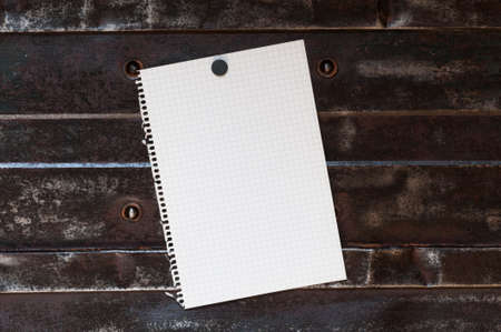Memo, from squared paper with copy space against a metal background.の写真素材