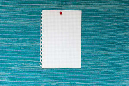 Memo, from squared paper with copy space against a blue woven fabric.の写真素材