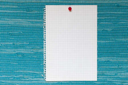 Memo, from squared paper with copy space against a blue woven fabric.の写真素材