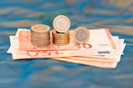 One Portuguese euro banknotes in front of blue background.