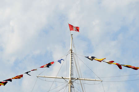 Flag of Hamburg with sea flag and background is blue sky with white clouds.の写真素材
