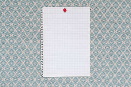 Memo, from squared paper with copy space against a blue woven fabric.の写真素材