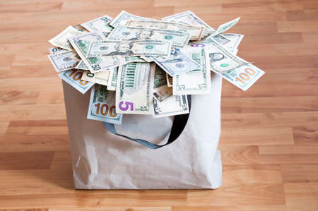 A bag full of U.S. Dollar as background.の写真素材