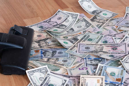 Vacuum cleaner sucks on U.S. dollars.の写真素材