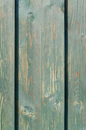 Background from wooden boards with weathered green color.の写真素材