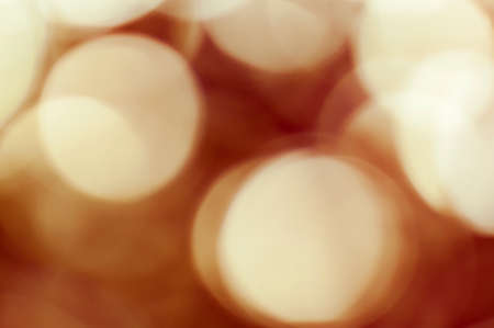 Abstract red blurred retro background with light spots.の写真素材