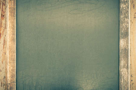 Old blackboard with copy space and weathered wood frame.の写真素材