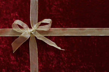 Background, gift box of red velvet with gold ribbonの写真素材