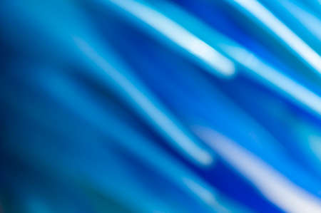 Abstract blue blurred background with textured effect.の写真素材