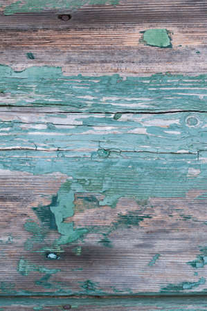 Background from wooden boards with weathered paint.の写真素材