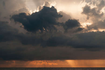Sunset at sea with cloudscape.の写真素材