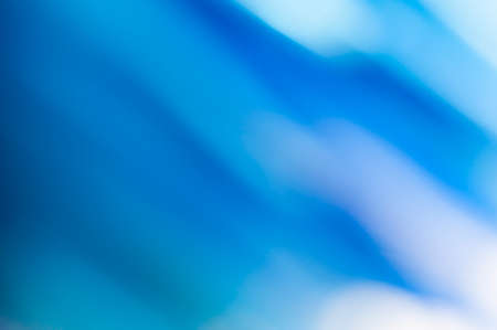 Abstract blue blurred background with textured effect.の写真素材