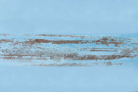 Old scratched blue wooden background with copy space.