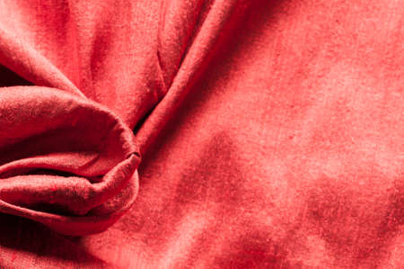 Background of red raw silk with textured effect.の写真素材