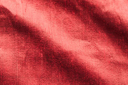Background of red raw silk with textured effect.の写真素材