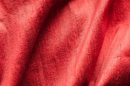 Background of red raw silk with textured effect.の写真素材