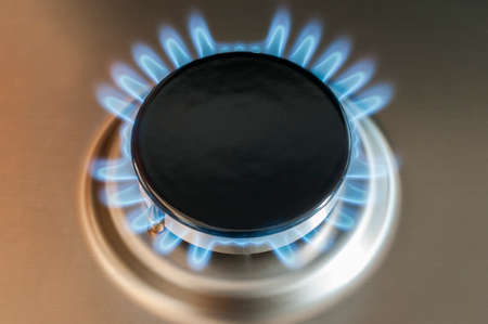 Gas flame of a gas stove in stainless steel.の写真素材