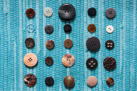 Collection of various buttons against a blue background.の写真素材