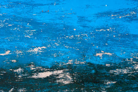 Weathered scratched blue black background of wood.の写真素材
