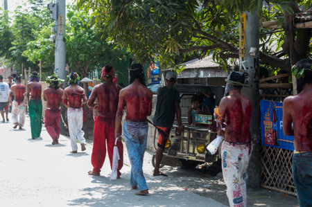 San Fernando , Luzon, Philippines, March 25, 2016 Easter procession in the city of San Fernando, Luzon Island, Philippines. Flagellants who mortify themselves on Good Friday on the road.のeditorial素材