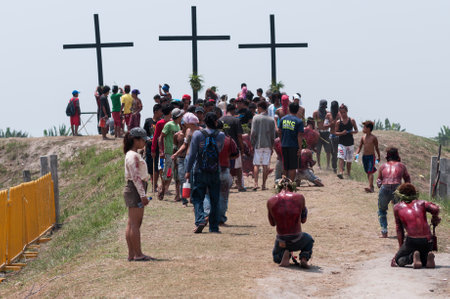 San Fernando , Luzon, Philippines, March 25, 2016: Easter procession in the city of San Fernando, Luzon Island, Philippines. Flagellants who mortify themselves on Good Friday on a field.のeditorial素材