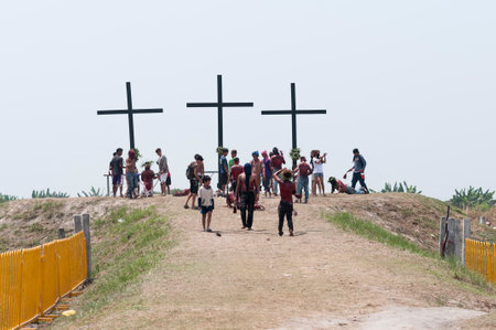 San Fernando , Luzon, Philippines, March 25, 2016: Easter procession in the city of San Fernando, Luzon Island, Philippines. Flagellants who mortify themselves on Good Friday on a field.のeditorial素材