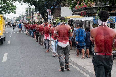 San Fernando , Luzon, Philippines, March 25, 2016 Easter procession in the city of San Fernando, Luzon Island, Philippines. Flagellants who mortify themselves on Good Friday on the road.のeditorial素材