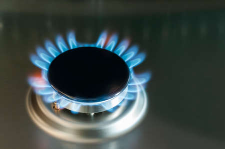 Gas flame of a gas stove in stainless steel.の写真素材