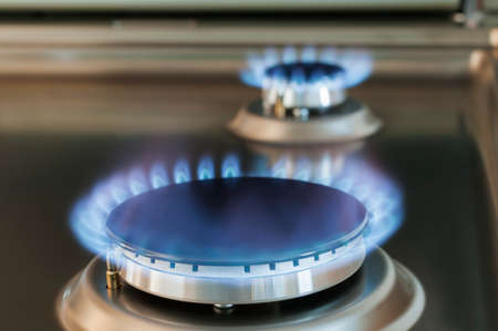 Gas flame of a gas stove in stainless steel.の写真素材