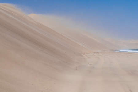 Sandstorm on the Skeleton Coast, dunes to the Atlantic Ocean, Namib Desert, Namibia, Africa.