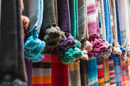 Background of different colorful scarves of cotton.