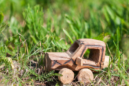 Wooden SUV, toy car in an extreme landscape.の写真素材