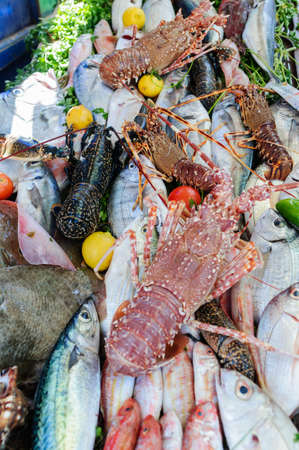Market stall with fresh fish and seafood.の写真素材