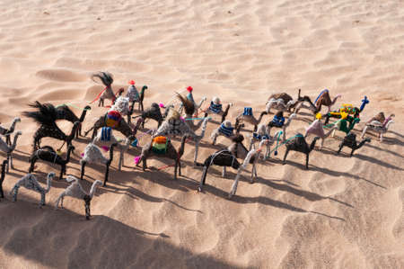 Toy camels as a souvenir, in the Sahara at a water fountain.の写真素材