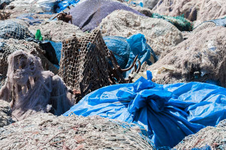 Piles of fishing nets dry in the sunlight.の写真素材