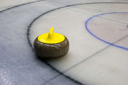 Granite stone for curling game on the iceの写真素材
