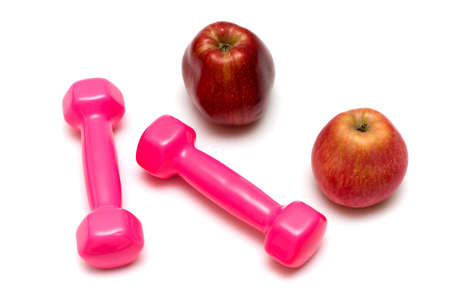 Dumbbells and apples on the white,fitnessの写真素材