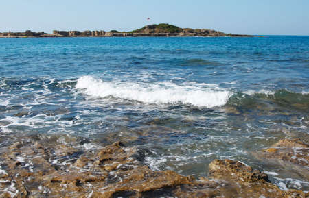 Waves and splashes at sea coast in turkeyの写真素材
