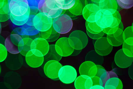 Holiday background Defocus of green lights.