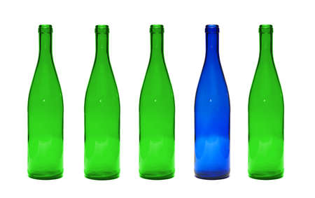 glass blue bottle among green bottles. Concept of difference. の写真素材