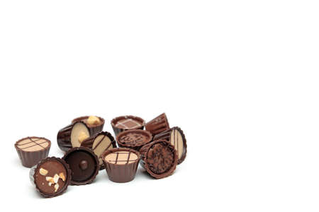 Mixed Chocolates heap against a white background with copy spaceの写真素材