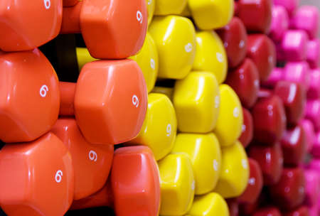 dumbbell, barbell. Background of many color weightsの写真素材