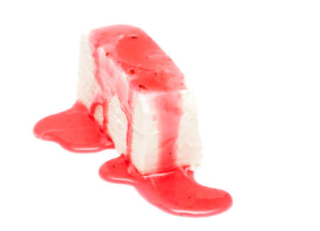 Ice-cream piece in a syrup on whiteの写真素材