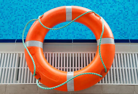 lifebuoy in blue water in swimming pool