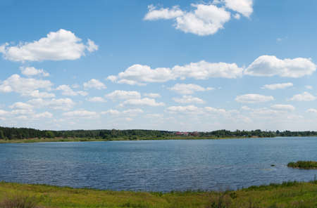 Panoramic lake the sky and cloudsの写真素材