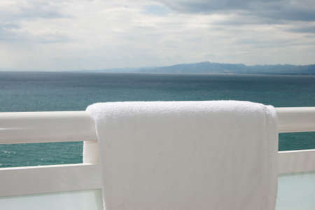 Pure white towel hangs on a balconyの写真素材