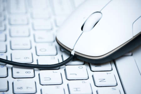 White computer mouse on  the keyboard